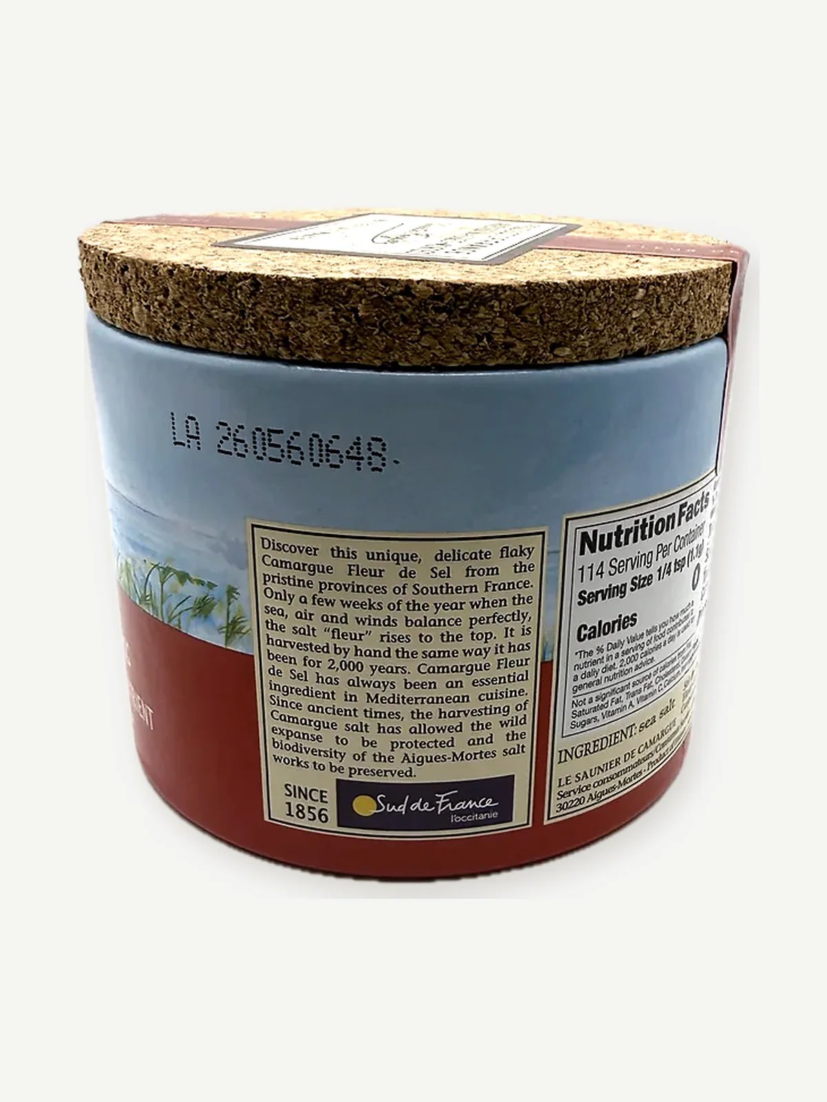 Back of a Le Saunier de Camargue fleur de sel drum with cork lid, printed lot code and the producer story panel