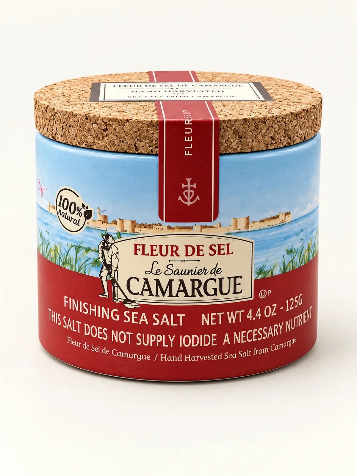 Front of a Le Saunier de Camargue fleur de sel drum with cork lid and a painted view of the Aigues-Mortes ramparts