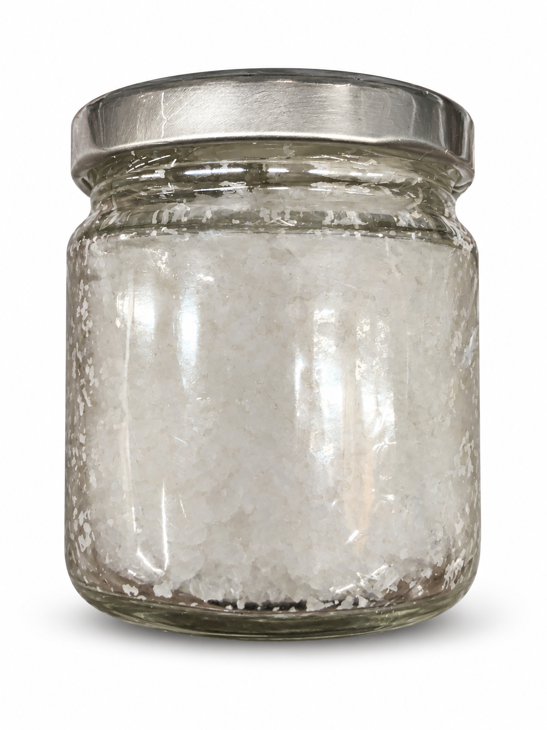 Unlabelled side of Wegmans Fleur de Sel glass jar showing salt crystals — AI-cleaned presentation